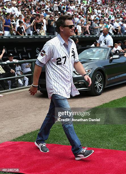 Former player Geoff Blum of the Chicago White Sox is introduced to the crowd during a ceremony honoring the 10th anniversary of the 2005 World Series...