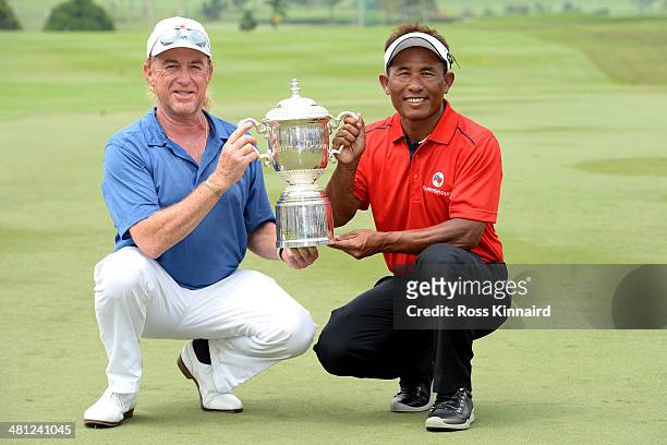 Miguel Angel Jimenez, Captain of Team Europe and Thongchai Jaidee, Captain of Team Asia are pictured together with the trophy after the first EurAsia...