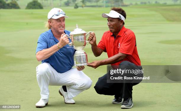 Miguel Angel Jimenez, Captain of Team Europe and Thongchai Jaidee, Captain of Team Asia are pictured together with the trophy after the first EurAsia...