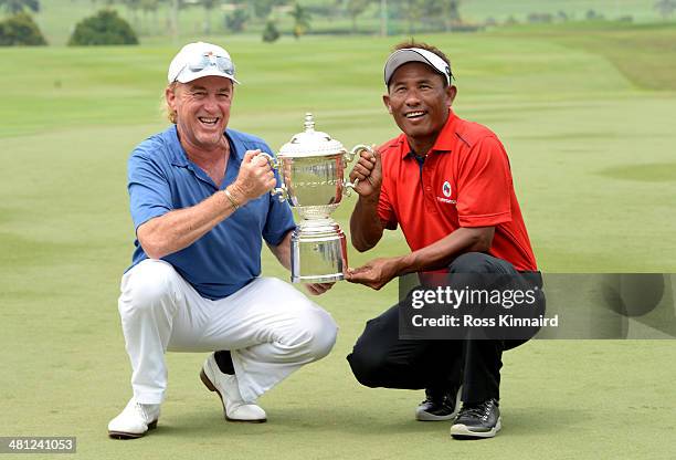 Miguel Angel Jimenez, Captain of Team Europe and Thongchai Jaidee, Captain of Team Asia are pictured together with the trophy after the first EurAsia...