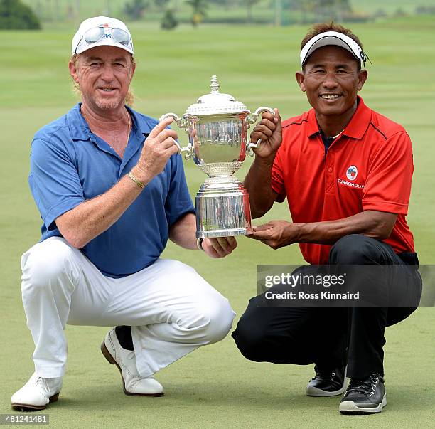 Miguel Angel Jimenez, Captain of Team Europe and Thongchai Jaidee, Captain of Team Asia are pictured together with the trophy after the first EurAsia...