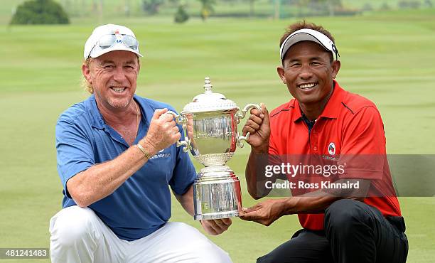 Miguel Angel Jimenez, Captain of Team Europe and Thongchai Jaidee, Captain of Team Asia are pictured together with the trophy after the first EurAsia...