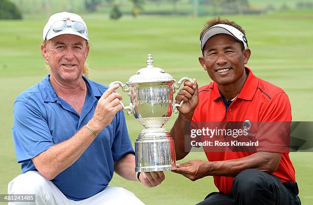 Miguel Angel Jimenez, Captain of Team Europe and Thongchai Jaidee, Captain of Team Asia are pictured together with the trophy after the first EurAsia...