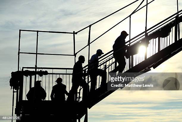Tiger Woods of the United States walks across a footbridge after the second round of the 144th Open Championship at The Old Course on July 18, 2015...