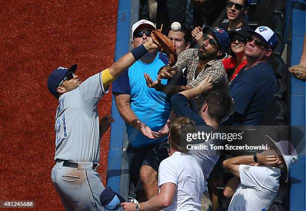 James Loney of the Tampa Bay Rays drops a foul pop up in the fifth inning during MLB game action against the Toronto Blue Jays on July 18, 2015 at...