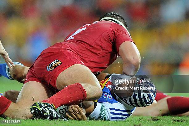 Gio Aplon of the Stormers is tackled during the round seven Super Rugby match between the Reds and the Stormers at Suncorp Stadium on March 29, 2014...