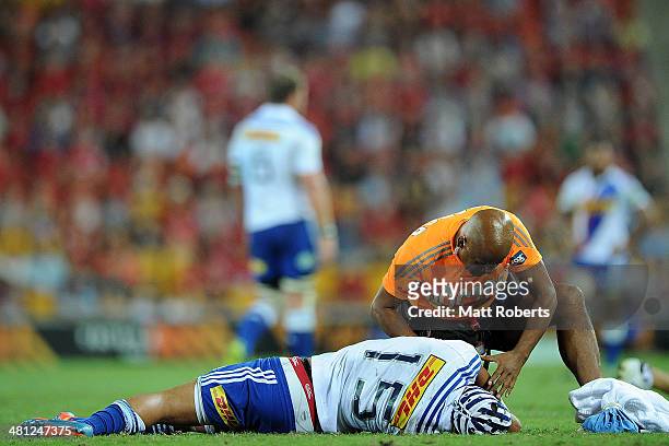 Gio Aplon of the Stormers receives medical attention on the field during the round seven Super Rugby match between the Reds and the Stormers at...