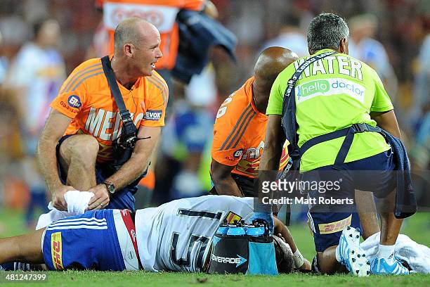 Gio Aplon of the Stormers receives medical attention on the field during the round seven Super Rugby match between the Reds and the Stormers at...