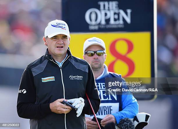 Paul Lawrie of Scotland and caddie David Kenny look on from the 18th tee during the second round of the 144th Open Championship at The Old Course on...