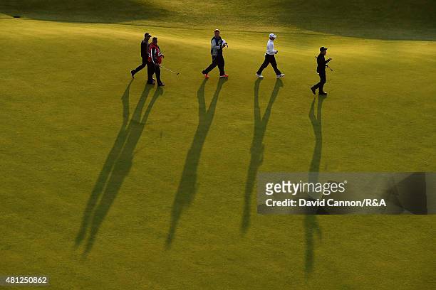 General view is seen as Tyrrell Hatton of England, Amateur Paul Kinnear of England and Scott Arnold of Australia walk up off the 18th hole with their...