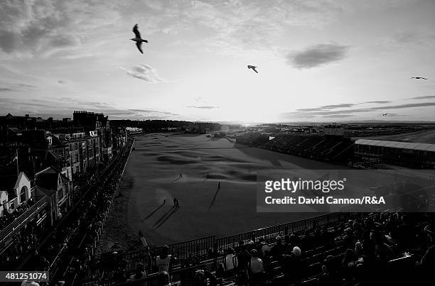 General view of the 18th and first hole is seen as fans watch Scott Arnold of Australia, Amateur Paul Kinnear of the United States and Tyrrell Hatton...