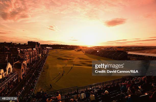General view of the 18th and first hole is seen as fans watch Scott Arnold of Australia, Amateur Paul Kinnear of the United States and Tyrrell Hatton...