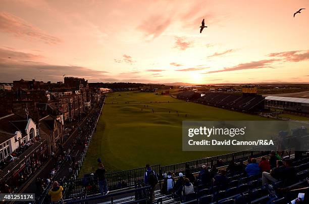 General view of the 18th and first hole is seen as fans watch Jonathan Moore of the United States, Scott Hend of Australia and Ryan Fox of New...