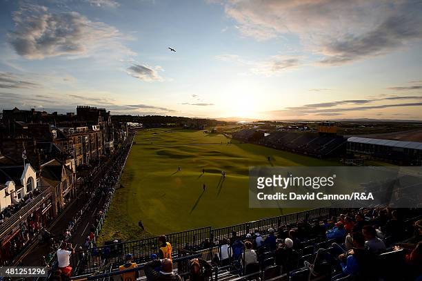 General view of the 18th and first hole is seen as fans watch Paul Kinnear of the United States, Scott Arnold of Australia and Tyrrell Hatton of...