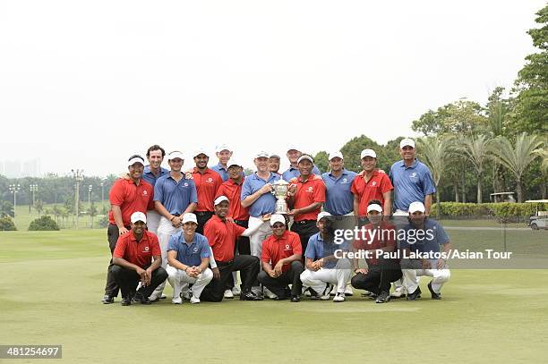 Team Europe and Team Asia pictured with the EurAsia Cup winner's trophy during day three of the EurAsia Cup at Glenmarie G&CC on March 29, 2014 in...