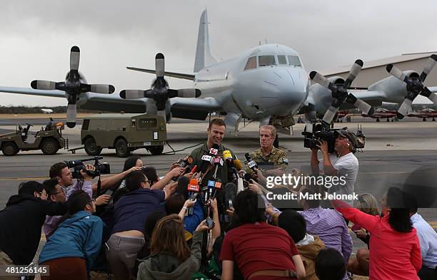 Royal Australian Airforce Flight Lieutenant Russell Adams speaks to media at Pearce Airbase on March 29, 2014 in Perth, Australia. Five search...