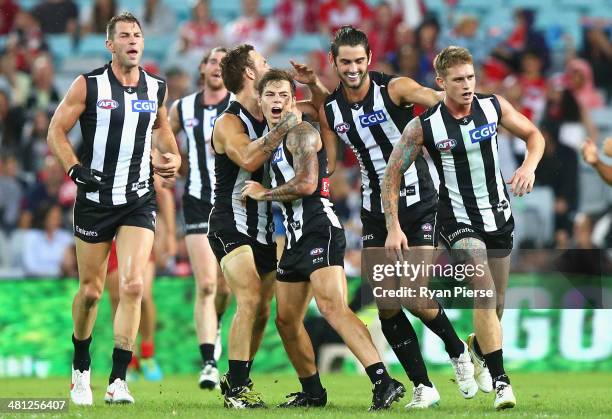 Jamie Elliot of the Magpies celebrates a goal during the round two AFL match between the Sydney Swans and the Collingwood Magpies at ANZ Stadium on...