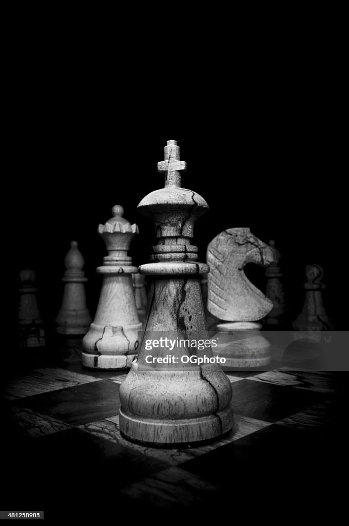 Black and White image of wooden chess pieces