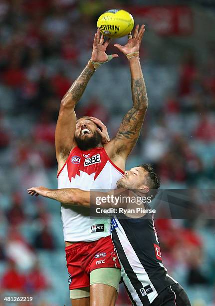 Lance Franklin of the Swans competes for the ball against Nathan Brown of the Magpies during the round two AFL match between the Sydney Swans and the...