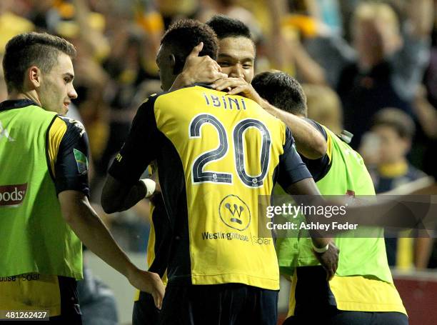 Kim Seung-yong of the Mariners hugs teammate Bernie Ibini after scoring a goal during the round 25 A-League match between the Central Coast Mariners...