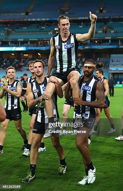 Nick Maxwell of the Magpies is chaired from the ground after the round two AFL match between the Sydney Swans and the Collingwood Magpies at ANZ...