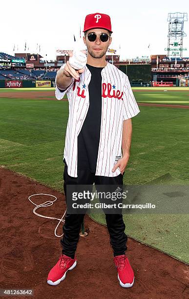 Rapper/songwriter Jake Miller throws the first pitch at the Miami Marlins Vs Philadelphia Phillies Game at Citizens Bank Park on July 18, 2015 in...