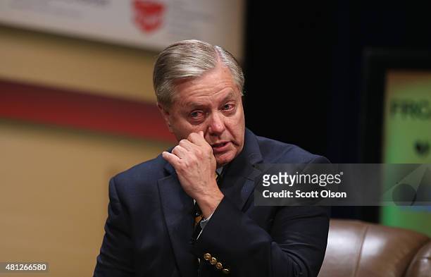 Republican presidential candidate Senator Lindsey Graham of South Carolina fights back tears as he speaks about his parents at The Family Leadership...
