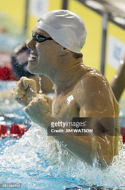 Gold medalist Henrique Rodrigues of Brazil celebrates after competing in the Men's 200M Individual Medley finals at the 2015 Pan American Games in...