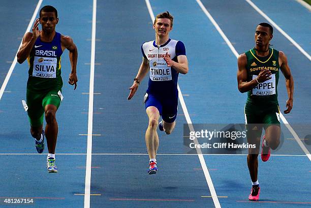 Derick Silva of Brazil, Cameron Tindle of Great Britain, and Kyle Appel of South Africa in action during the Boys 200 Meters Semi Final on day four...
