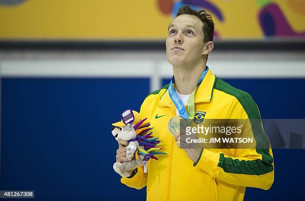 Gold medalist Henrique Rodrigues of Brazil poses after competing in the Men's 200M Individual Medley finals at the 2015 Pan American Games in...