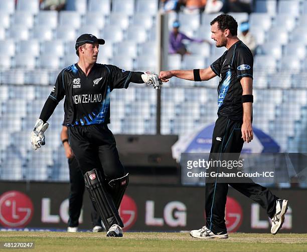 Kyle Mills and Luke Ronchi of New Zealand celebrate after dismissing Peter Borren of The Netherlands during New Zealand v Netherlands match at the...