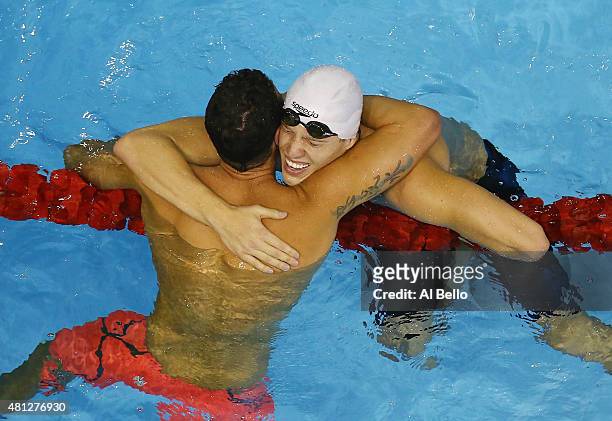 Henrique Rodrigues of Brazil celebrates winning the Men's 200m Individual Medley Fiinals with teamate Thiago Pereira at the Pan Am Games on July 18,...