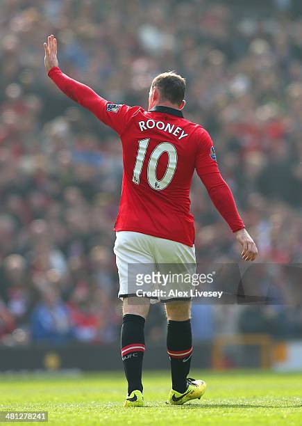 Wayne Rooney of Manchester United celebrates scoring his team's first goal during the Barclays Premier League match between Manchester United and...