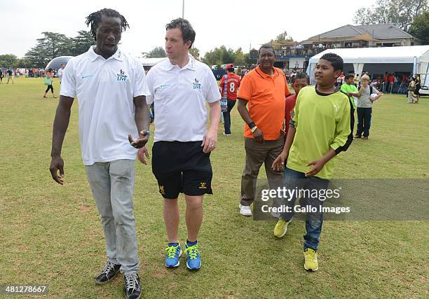 Robbie Fowler with Benjani Mwaruwari during the Barclays Premier League Live event on March 29 in Johannesburg, South Africa.