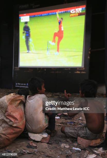 Two young boys watch the New Zealand versus Netherlands match during the ICC World Twenty20 Bangladesh 2014 in the Old Town on March 29, 2014 in...