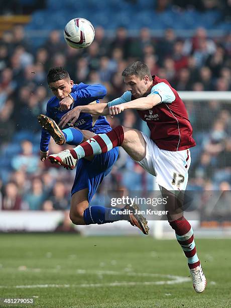 Anthony Knockaert of Leicester City battles with Chris Baird of Burnley during the Sky Bet Championship match between Burnley and Leicester City at...