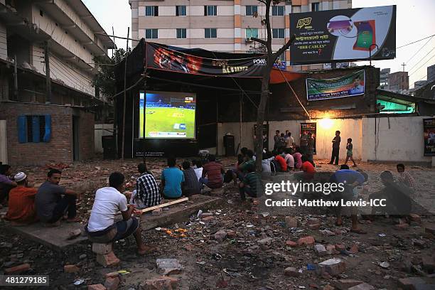 Locals watch the New Zealand versus Netherlands match during the ICC World Twenty20 Bangladesh 2014 in the Old Town on March 29, 2014 in Dhaka,...