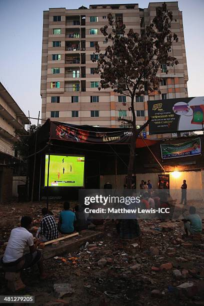 Locals watch the New Zealand versus Netherlands match during the ICC World Twenty20 Bangladesh 2014 in the Old Town on March 29, 2014 in Dhaka,...