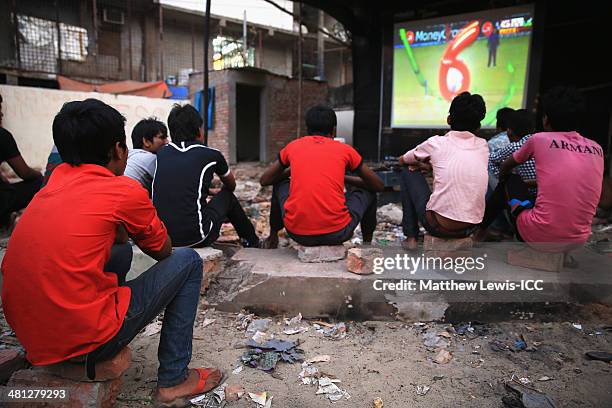 Locals watch the New Zealand versus Netherlands match during the ICC World Twenty20 Bangladesh 2014 in the Old Town on March 29, 2014 in Dhaka,...