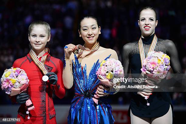 Julia Lipnitskaia of Russia, Mao Asada of Japan and Carolina Kostner of Italy pose with medal in the victory ceremony during ISU World Figure Skating...