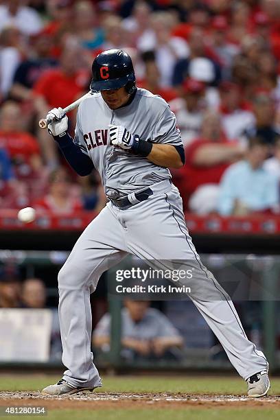 Giovanny Urshela of the Cleveland Indians is hit by a pitch thrown by Nate Adcock of the Cincinnati Reds in the top of the sixth inning at Great...