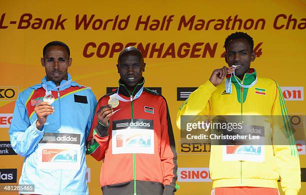 Gold medallist Geoffrey Kipsang Kamworor of Kenya poses with silver medalist Samuel Tsegay of Eritrea and bronze medallist Guye Adola of Ethiopia...