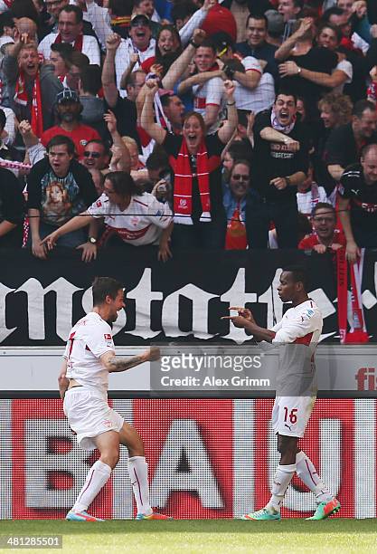 Martin Harnik of Stuttgart celebrates his team's second goal with team mate Ibrahima Traore during the Bundesliga match between VfB Stuttgart and...