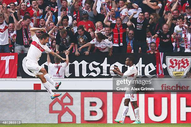 Martin Harnik of Stuttgart celebrates his team's second goal with team mate Ibrahima Traore during the Bundesliga match between VfB Stuttgart and...