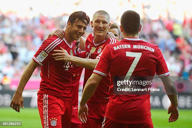 Claudio Pizarro , Bastian Schweinsteiger and Franck Ribery of Muenchen celebrate a goal during the Bundesliga match between FC Bayern Muenchen and...