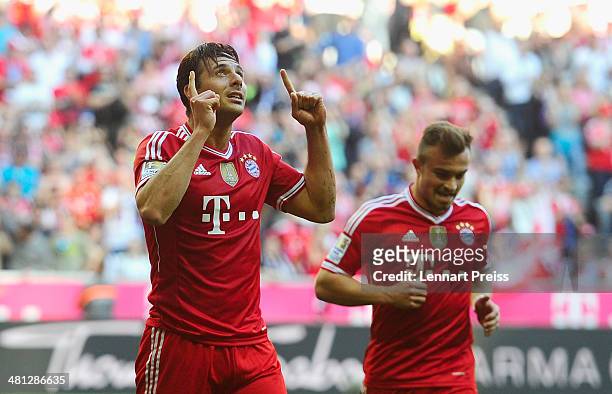 Claudio Pizarro and Xherdan Shaqiri of Muenchen celebrate a goal during the Bundesliga match between FC Bayern Muenchen and 1899 Hoffenheim at...