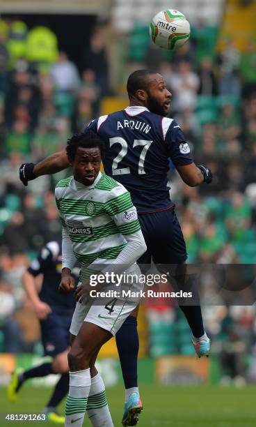 Efe Ambrose of Celtic and Yoann Arquin of Ross County challenge during the Scottish Premier League match between Celtic and Ross County at Celtic...