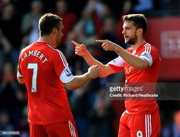 Jay Rodriguez of Southampton celebrates with teammate Rickie Lambert after scoring the opening goal during the Barclays Premier League match between...