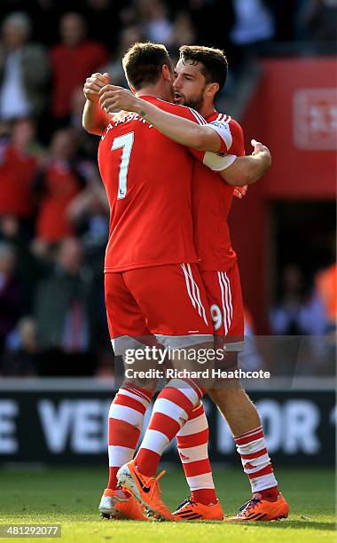 Jay Rodriguez of Southampton celebrates with teammate Rickie Lambert after scoring the opening goal during the Barclays Premier League match between...