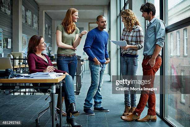 casual discussion between coworkers - netherlands map stockfoto's en -beelden